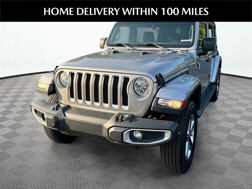 2019 Jeep Wrangler Unlimited Sahara in Billet Silver Metallic Clearcoat — front three-quarter view