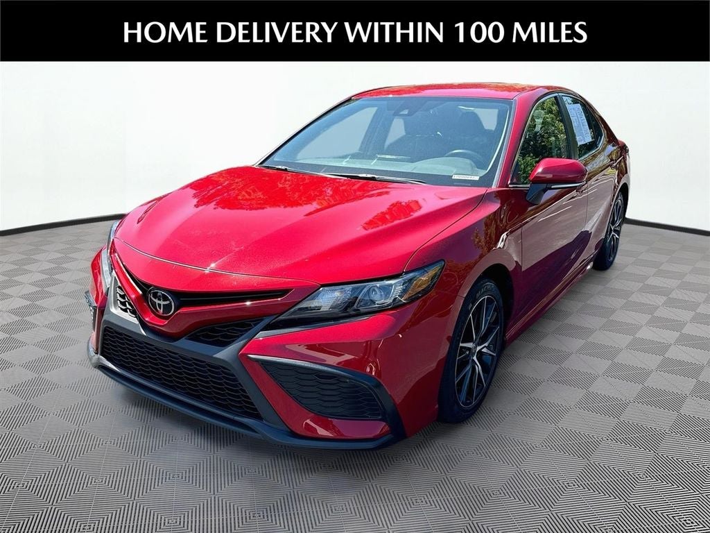 2023 Toyota Camry SE in Red — front three-quarter view