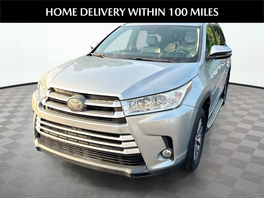 2017 Toyota Highlander XLE in Celestial Silver Metallic — front three-quarter view