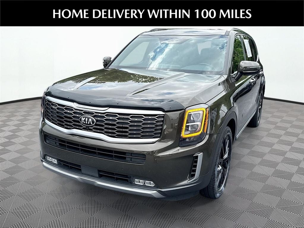 2021 Kia Telluride SX in Dark Moss — front three-quarter view