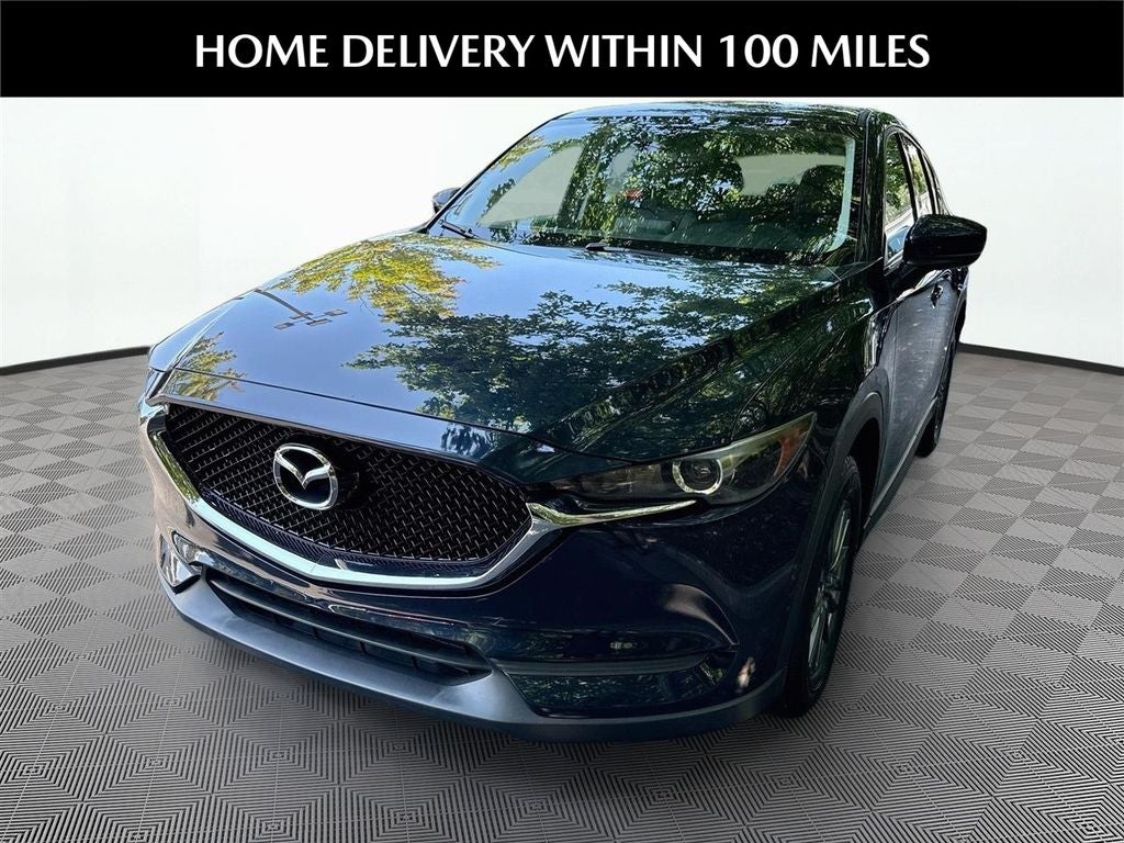 2017 Mazda Mazda CX-5 Touring in Deep Crystal Blue Mica — front three-quarter view