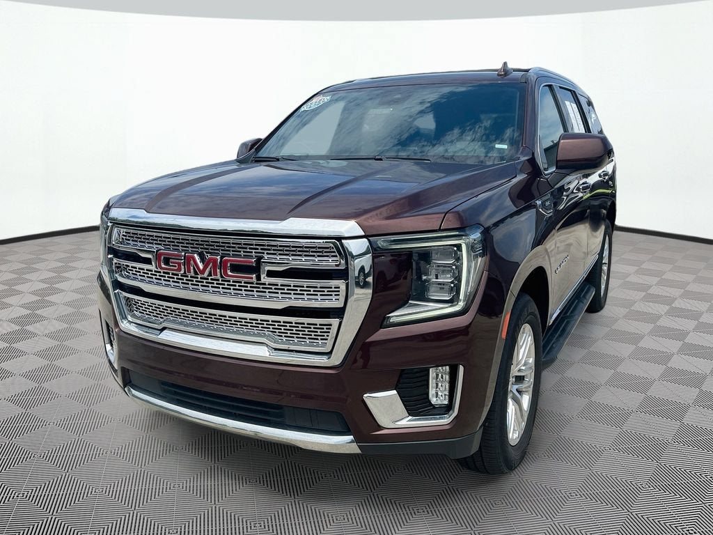 2023 GMC Yukon SLT in Redwood Metallic — front three-quarter view