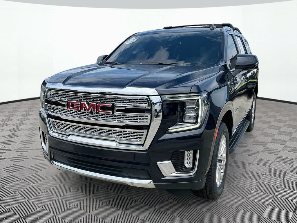 2022 GMC Yukon SLT in Midnight Blue Metallic — front three-quarter view