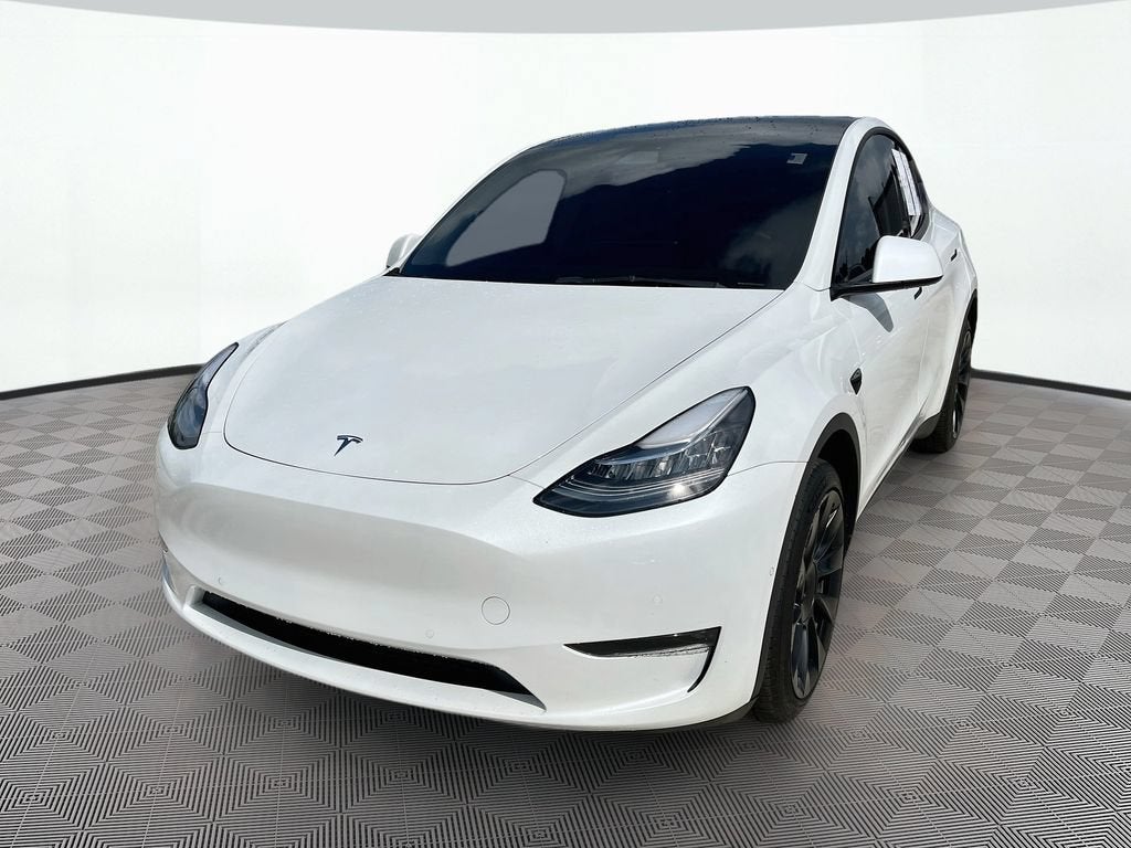 2022 Tesla Model Y Long Range in White — front three-quarter view